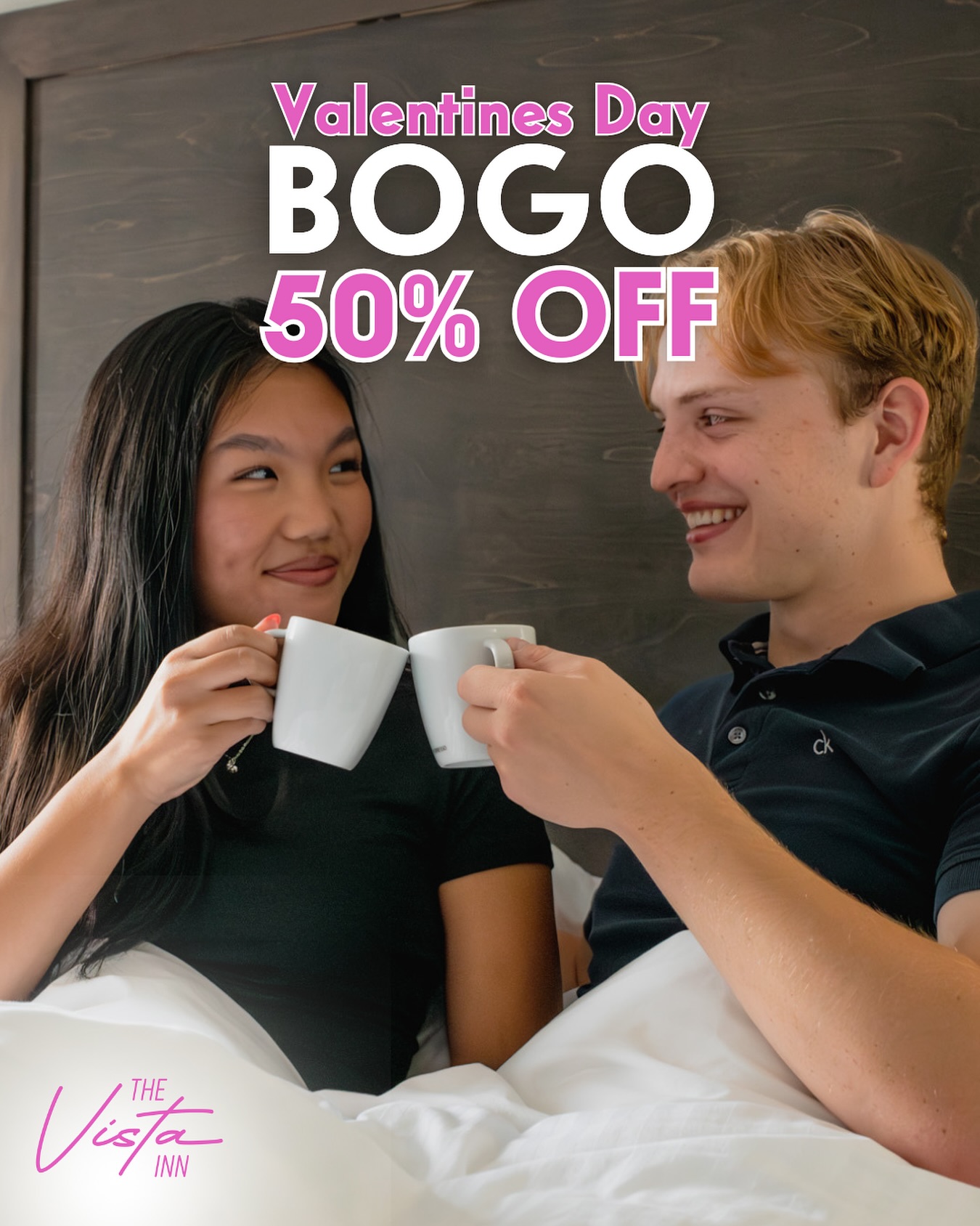A couple in bed clinks coffee mugs under a Valentine's Day BOGO 50% off promotion, with "The Vista Inn" logo in the corner.